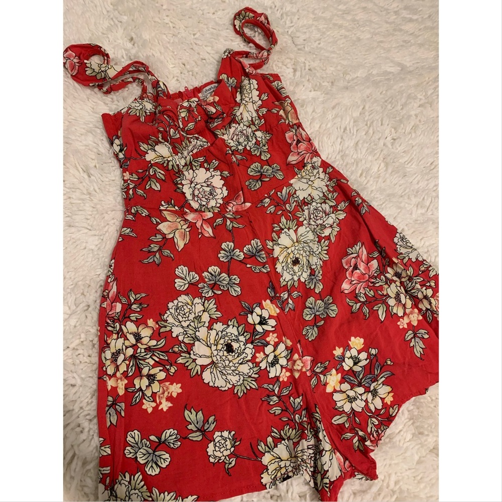 Romper orange with white flowers